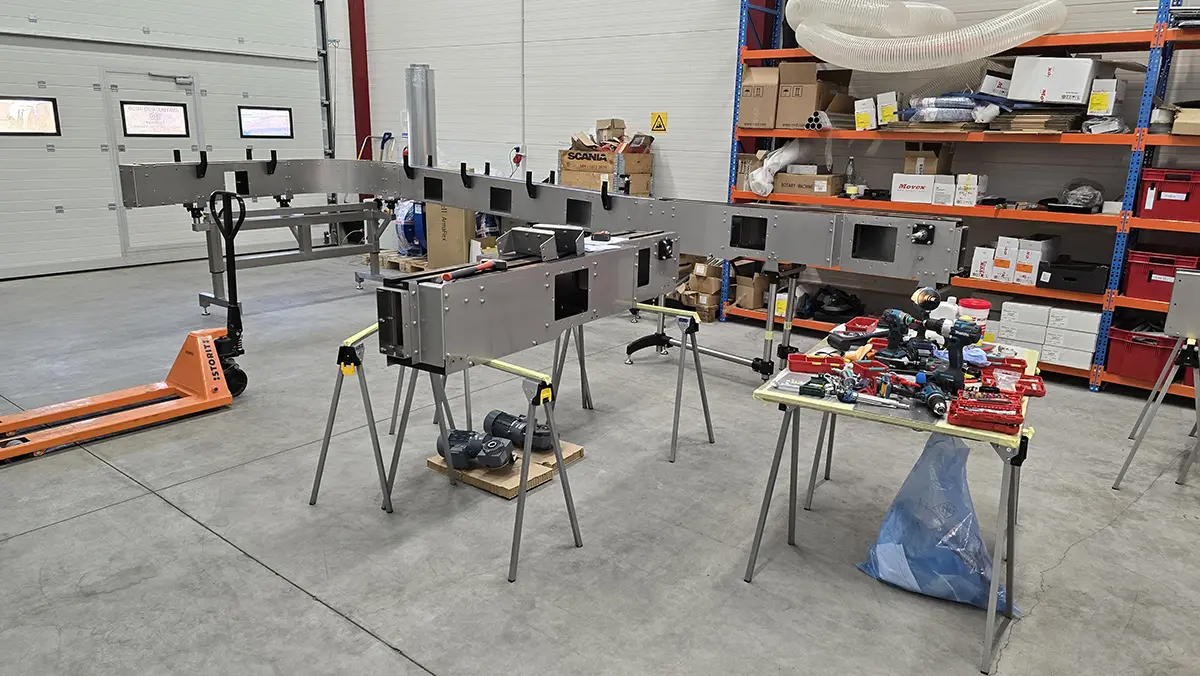 Stainless steel conveyor frames on assembly trestles